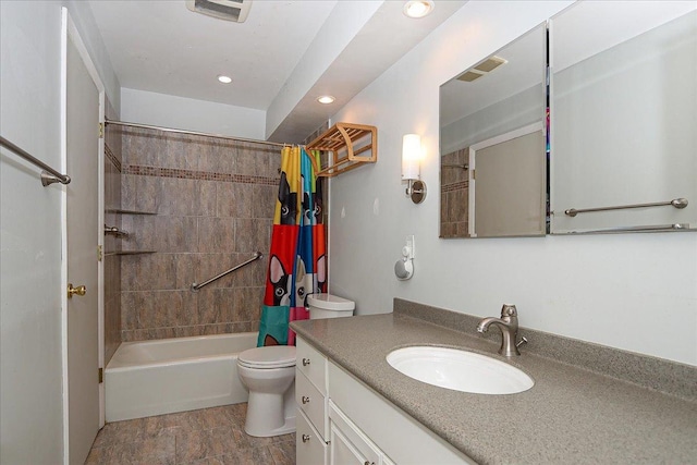 full bathroom with vanity, toilet, and shower / tub combo