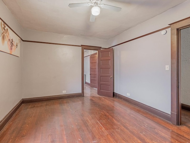 spare room featuring hardwood / wood-style flooring and ceiling fan