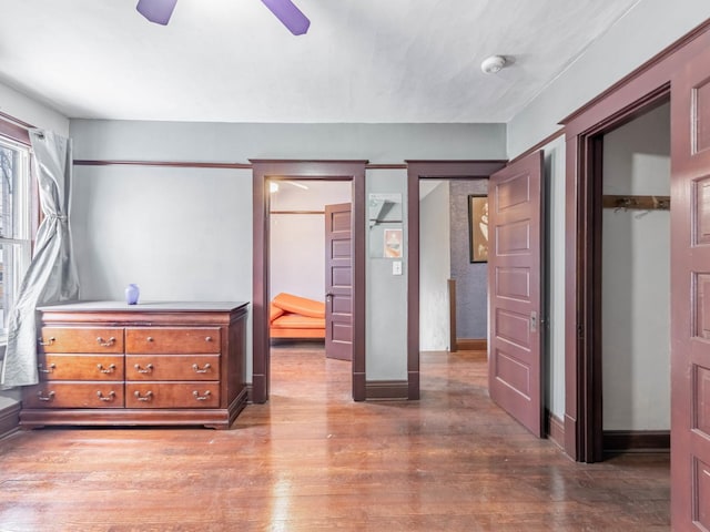 bedroom with hardwood / wood-style flooring and ceiling fan