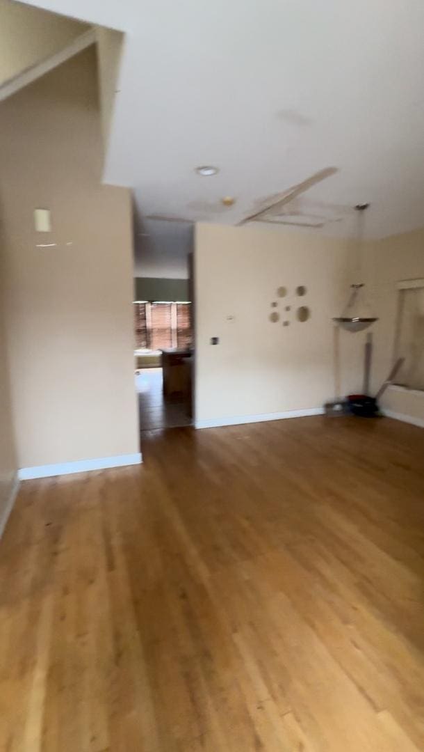 unfurnished living room with hardwood / wood-style floors