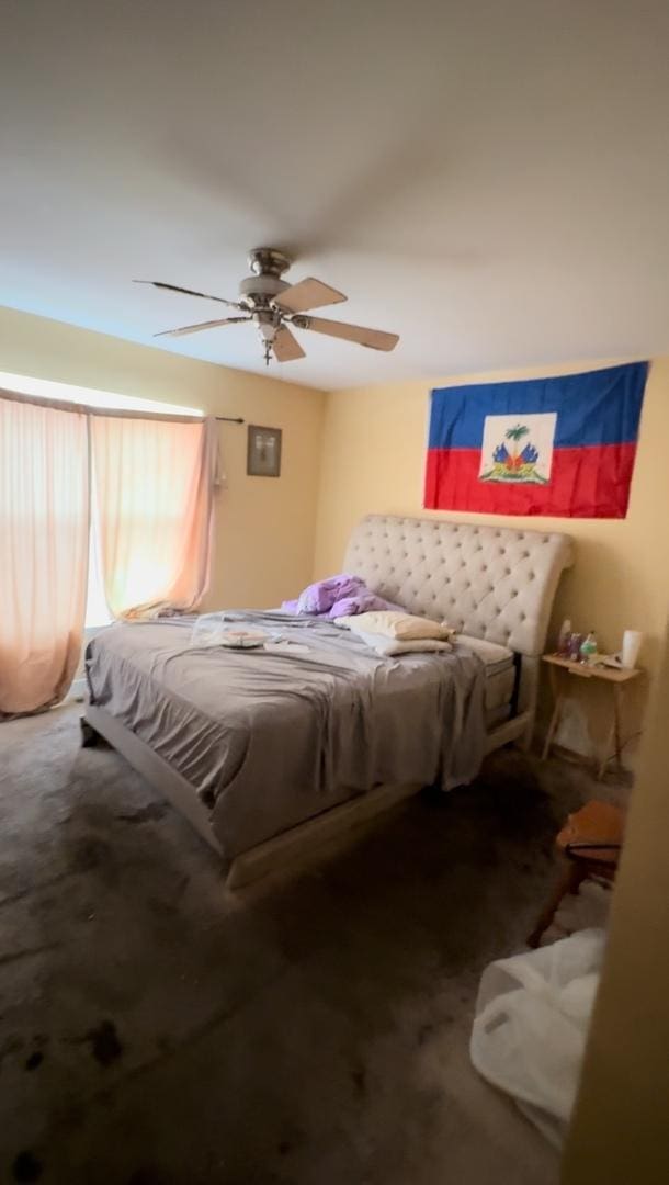 carpeted bedroom featuring ceiling fan