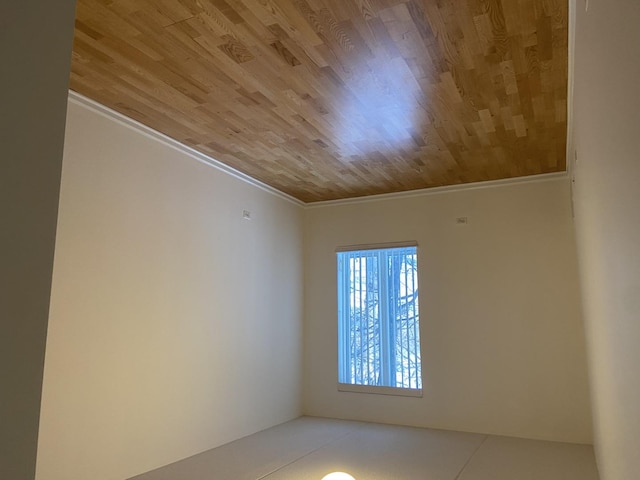 unfurnished room with wood ceiling