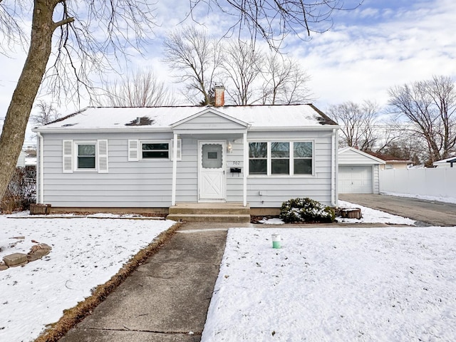 bungalow with an outbuilding and a garage