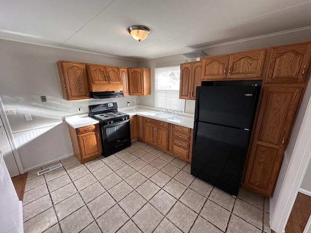 kitchen featuring exhaust hood, sink, crown molding, and black appliances