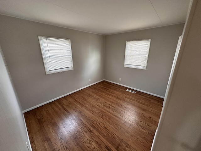 spare room featuring hardwood / wood-style flooring