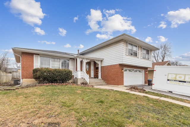 view of front of house featuring central AC unit, a garage, and a front lawn