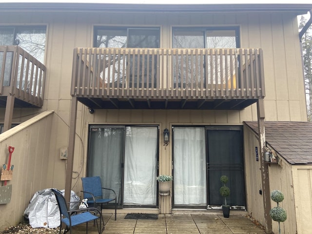 rear view of house featuring a balcony