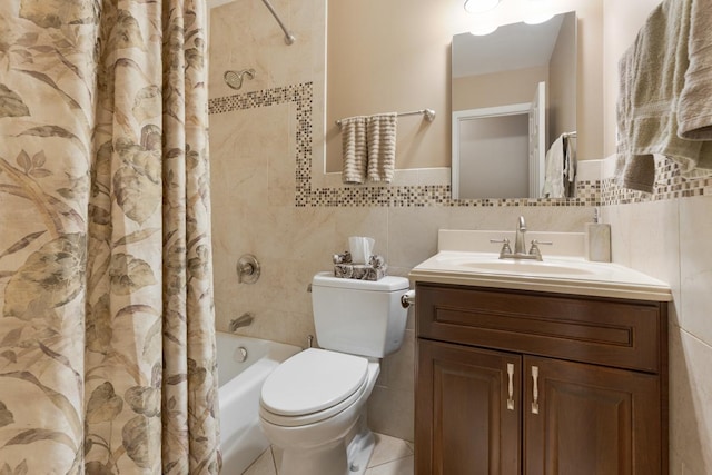 full bathroom featuring tile patterned flooring, tile walls, toilet, vanity, and shower / tub combo