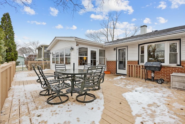 wooden terrace with grilling area and a sunroom