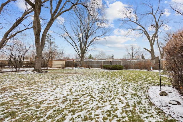 view of yard layered in snow