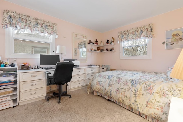 bedroom featuring light carpet