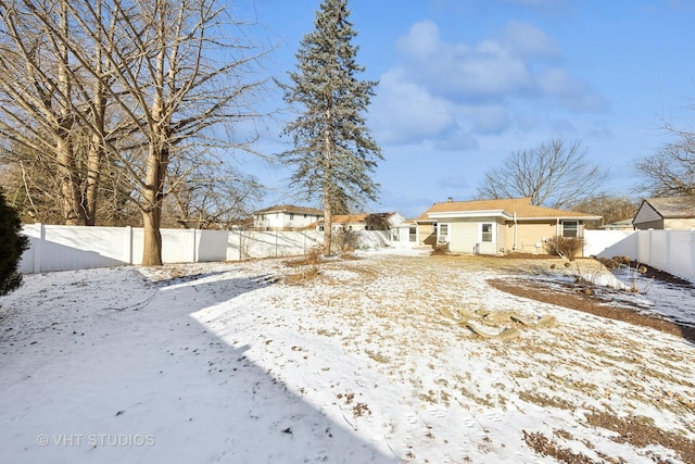 view of yard covered in snow