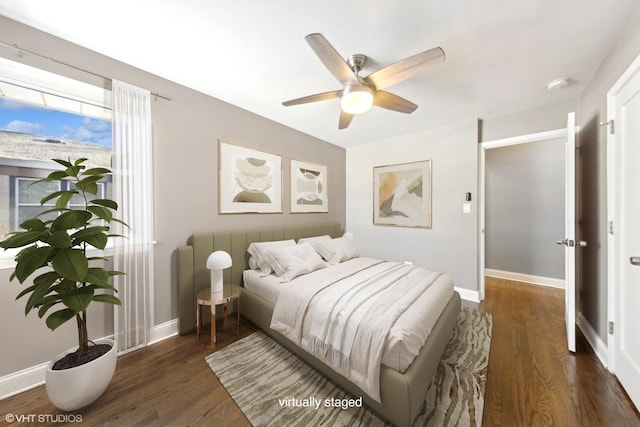 bedroom featuring dark wood-type flooring and ceiling fan