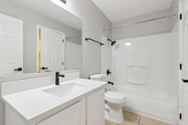 full bathroom with tile patterned floors, shower / washtub combination, vanity, and toilet