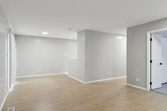 spare room featuring light hardwood / wood-style flooring