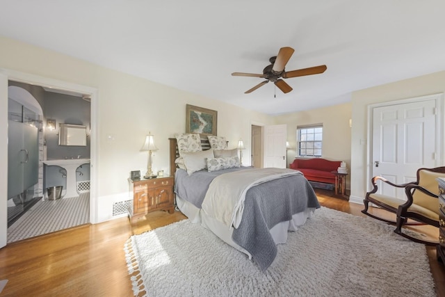 bedroom with ceiling fan and wood-type flooring