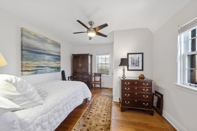 bedroom featuring ceiling fan and dark wood-type flooring