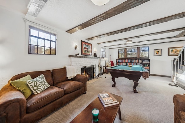 game room featuring light colored carpet, a brick fireplace, pool table, and beam ceiling