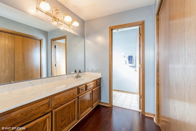 bathroom featuring hardwood / wood-style floors and vanity