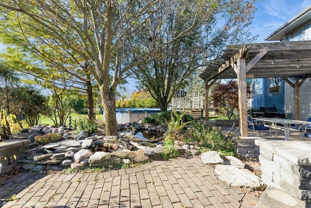 view of patio / terrace featuring a pergola