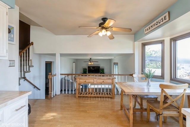 dining area featuring light hardwood / wood-style floors and ceiling fan