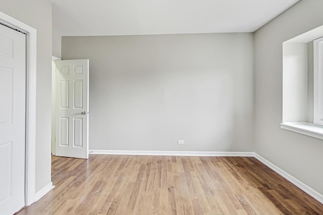 unfurnished room with light hardwood / wood-style flooring