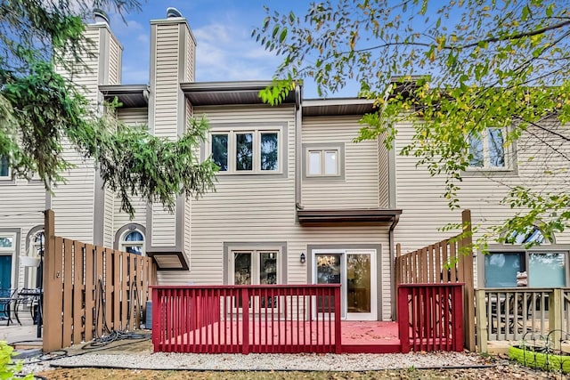 rear view of house with a wooden deck