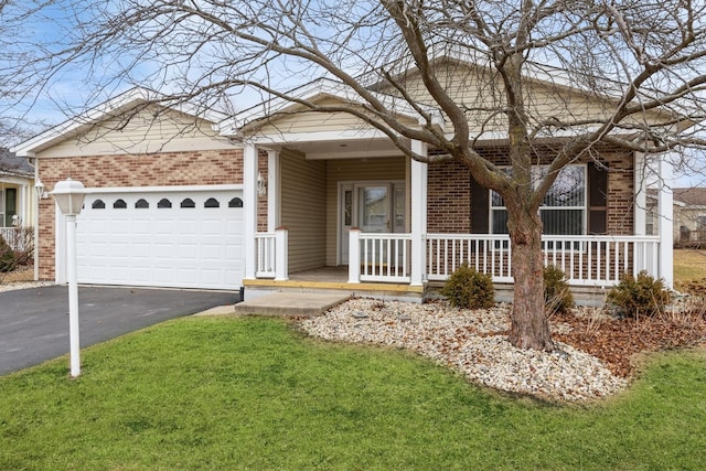 ranch-style home with a garage, a front yard, and a porch