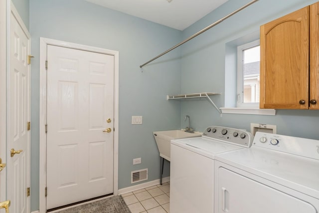 clothes washing area with cabinets, separate washer and dryer, sink, and light tile patterned floors