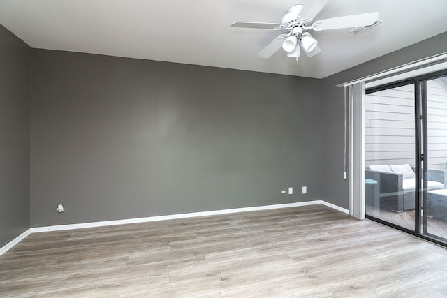 unfurnished room with light wood-type flooring and ceiling fan