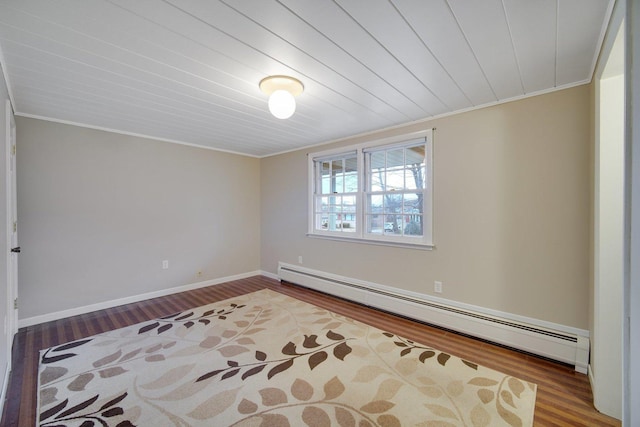 empty room featuring baseboard heating, crown molding, wood ceiling, and hardwood / wood-style flooring