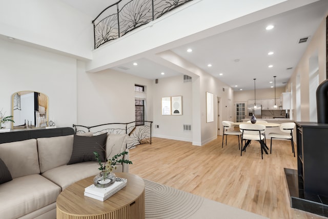 living room with light hardwood / wood-style floors