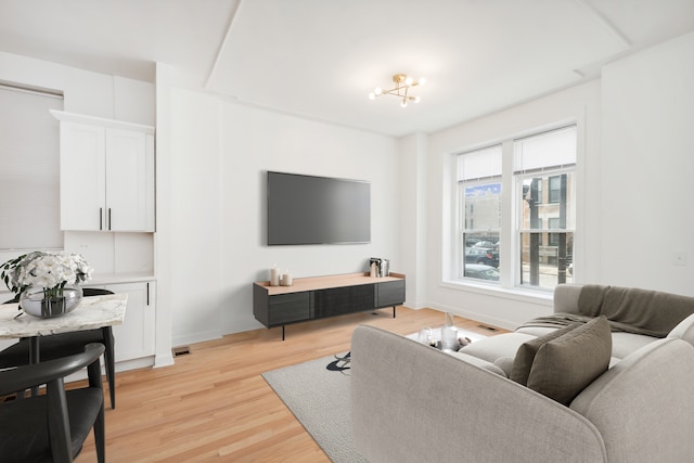 living room with a healthy amount of sunlight and light wood-type flooring