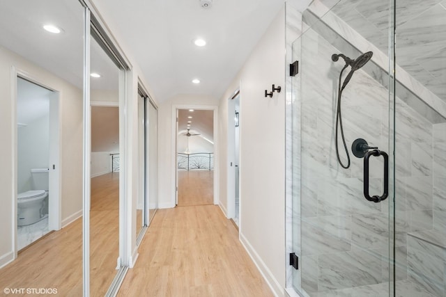 corridor with light hardwood / wood-style flooring