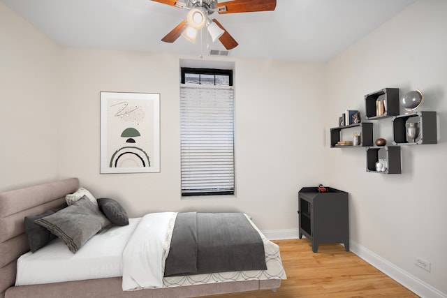 bedroom featuring light wood-type flooring and ceiling fan