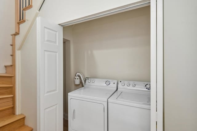 laundry room with independent washer and dryer