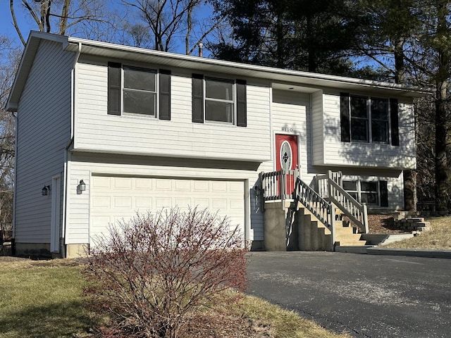 bi-level home featuring a garage