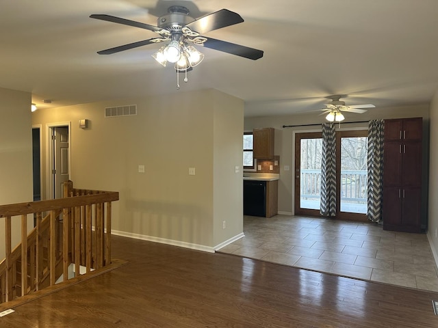 unfurnished room featuring dark hardwood / wood-style flooring and ceiling fan