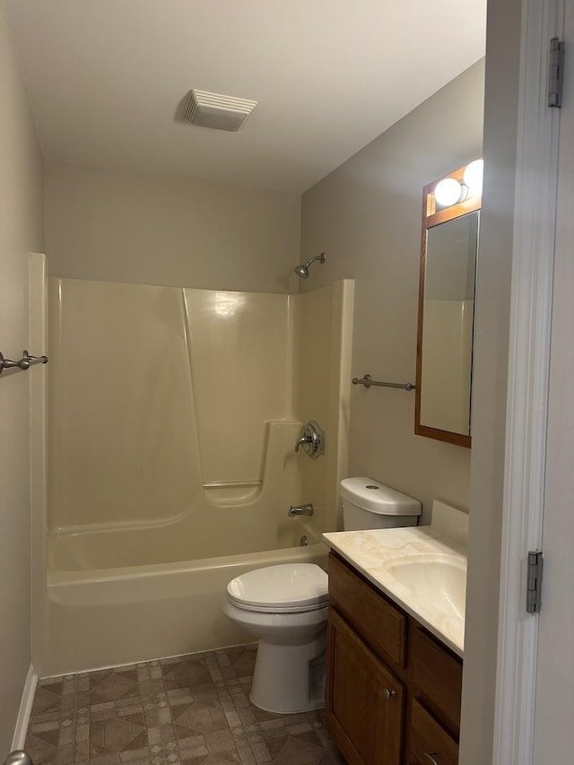 full bathroom featuring washtub / shower combination, vanity, and toilet