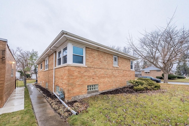 view of property exterior with a yard