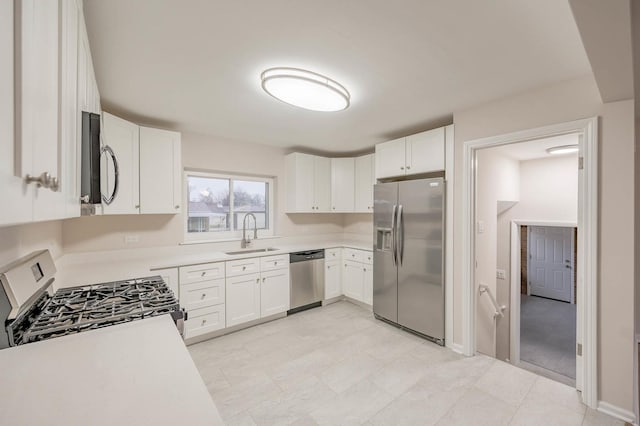 kitchen featuring sink, white cabinets, and stainless steel appliances