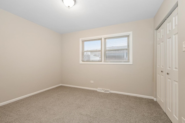 unfurnished room featuring carpet floors