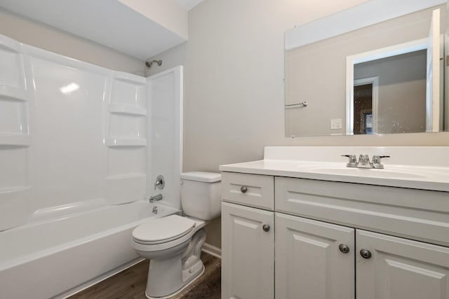 full bathroom with toilet, wood-type flooring, shower / bath combination, and vanity