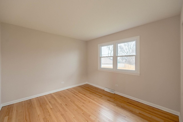 spare room featuring light hardwood / wood-style floors