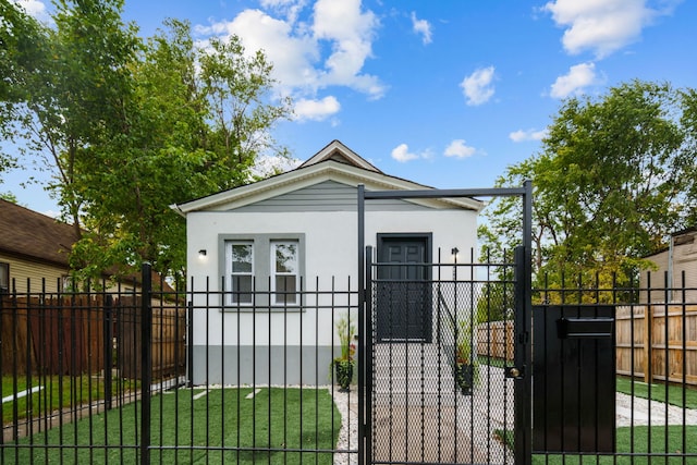 bungalow-style house featuring a front yard