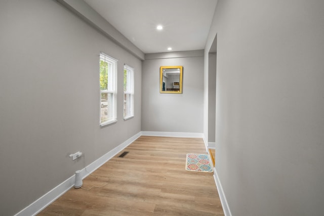 corridor with light hardwood / wood-style flooring