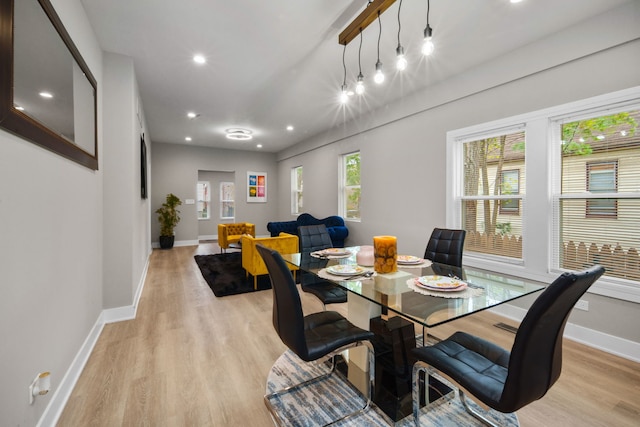 dining area featuring light wood-type flooring