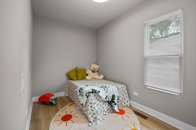 bedroom featuring hardwood / wood-style flooring