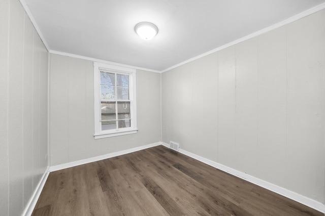 unfurnished room with wood-type flooring and ornamental molding