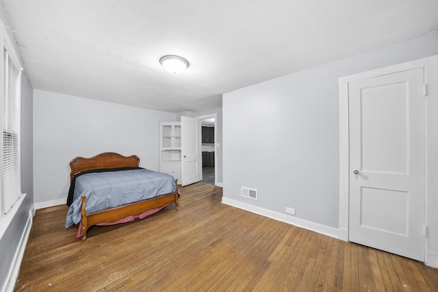 bedroom featuring hardwood / wood-style floors